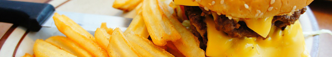 Eating American (Traditional) Burger Hot Dog at Chip's Old Fashioned Hamburgers restaurant in Dallas, TX.